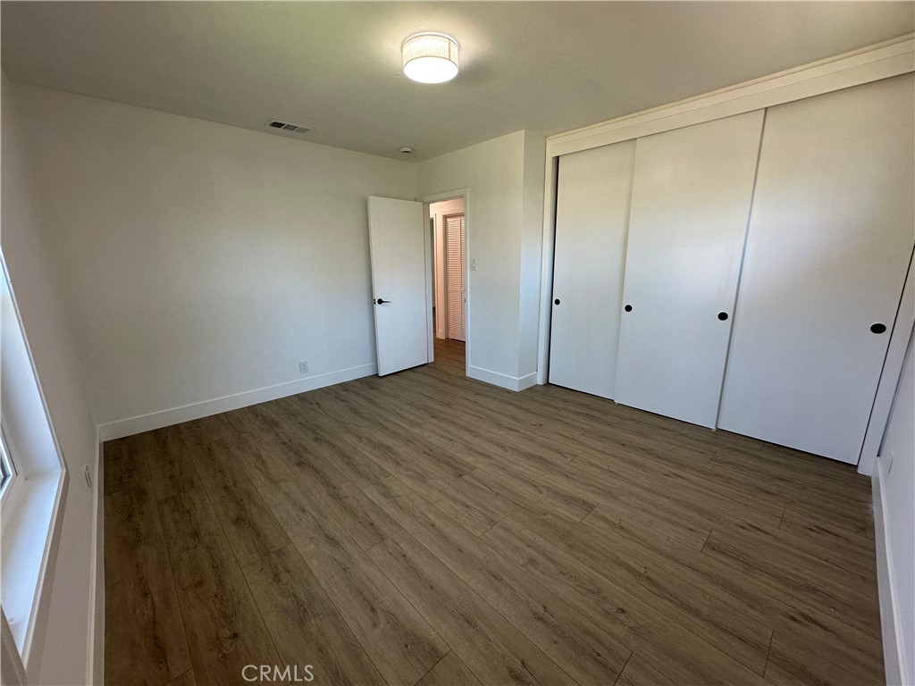 4561 Cover Street Riverside, CA 92506 - Photo 35 of 47 a view of an empty room with wooden floor