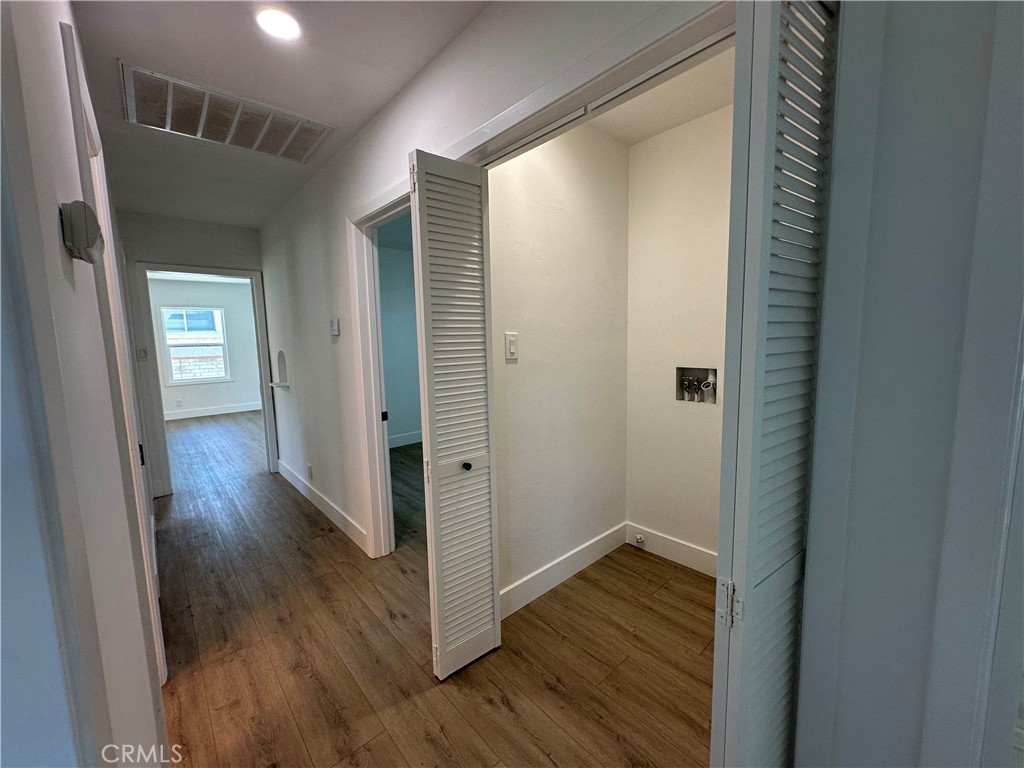 4561 Cover Street Riverside, CA 92506 - Photo 39 of 47 a view of a hallway with wooden floor
