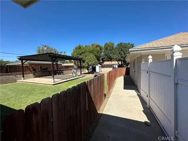 a view of a deck with a backyard
