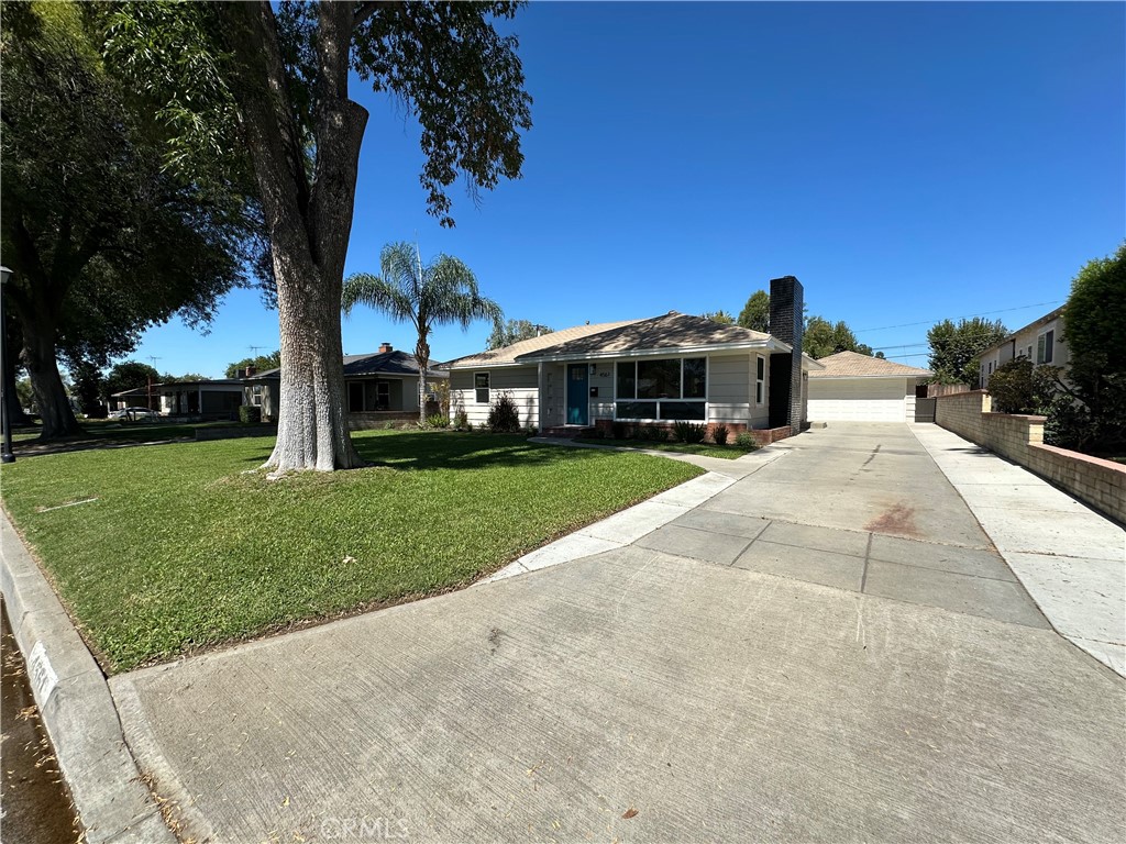 4561 Cover Street Riverside, CA 92506 - Photo 4 of 47 a view of a house with a yard