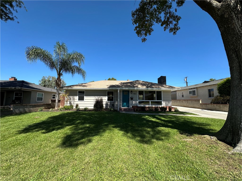 4561 Cover Street Riverside, CA 92506 - Photo 6 of 47 a front view of a house with garden