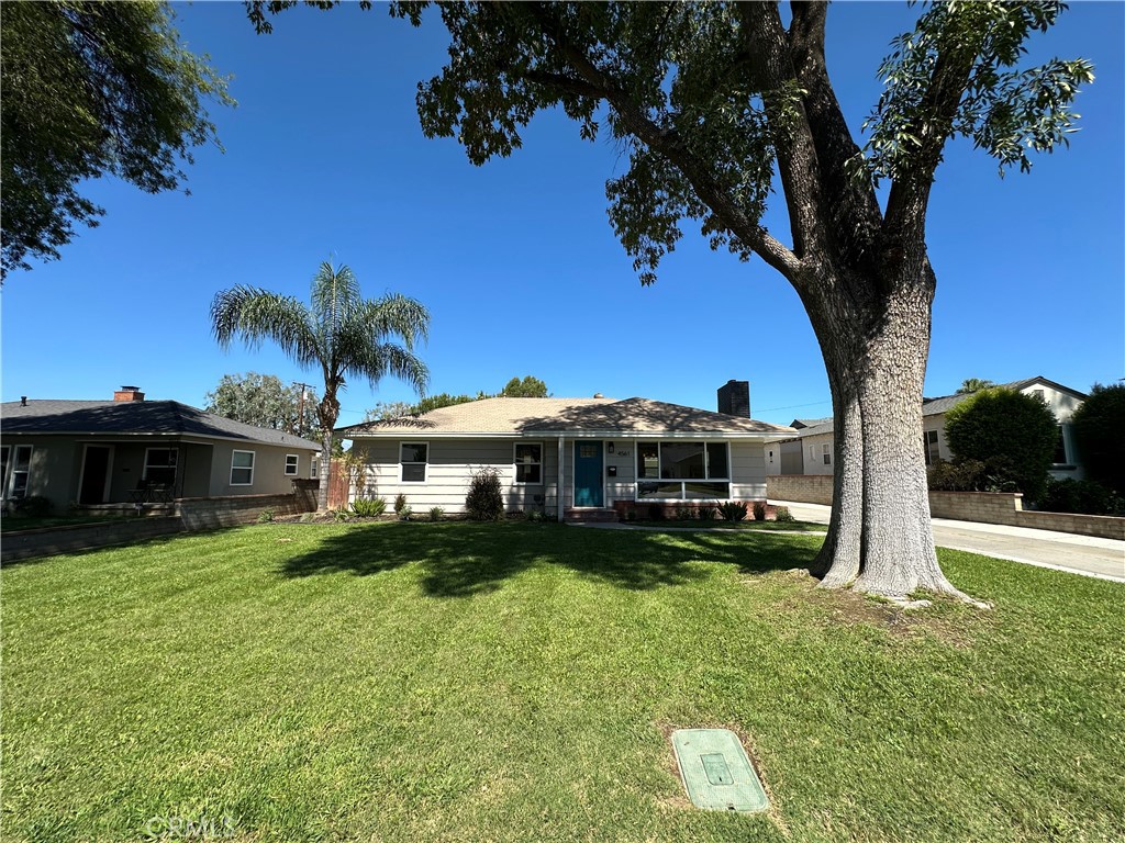 4561 Cover Street Riverside, CA 92506 - Photo 7 of 47 a view of a house with a yard