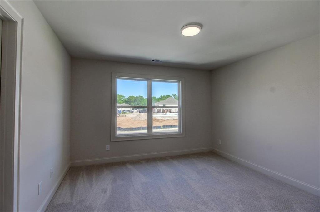 3055 Reserve Court Southwest Conyers, GA 30094 - Photo 25 of 33 an empty room with a window