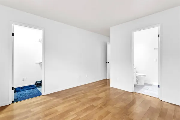 a bathroom with a double vanity sink and mirror
