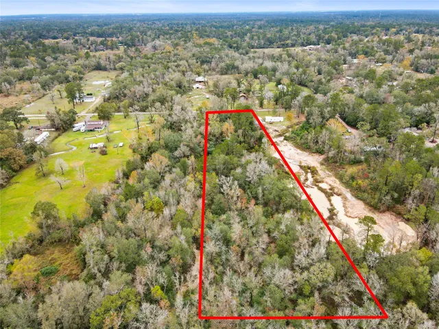 a view of a swimming pool with a yard