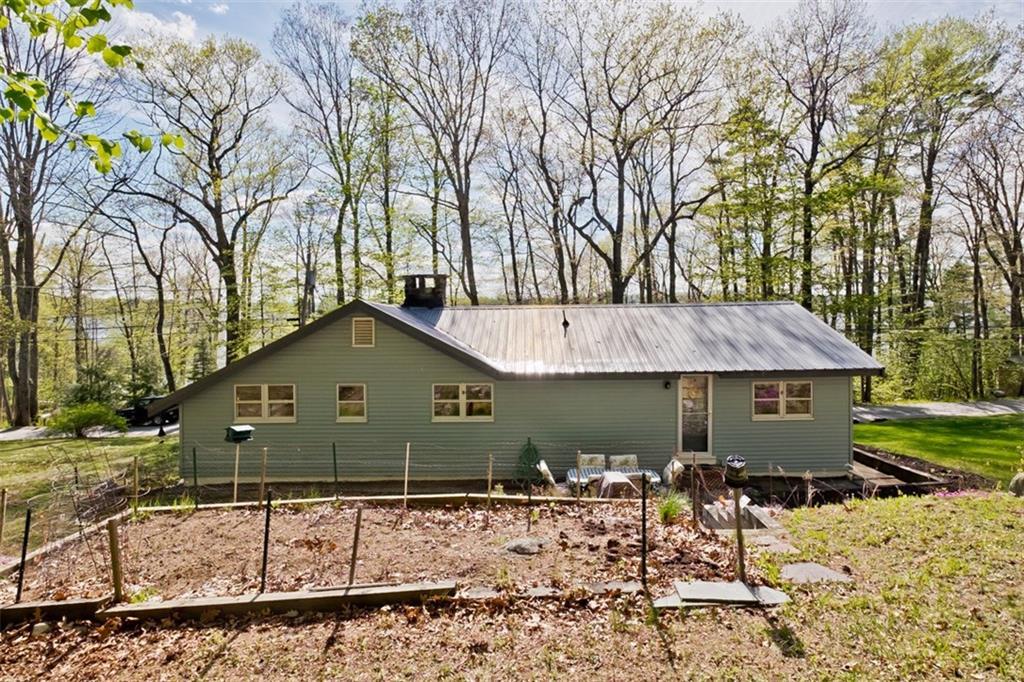 110 Mineral Spring Road Windham, ME 04062 - Photo 25 of 33 Back view of the home - shows a...