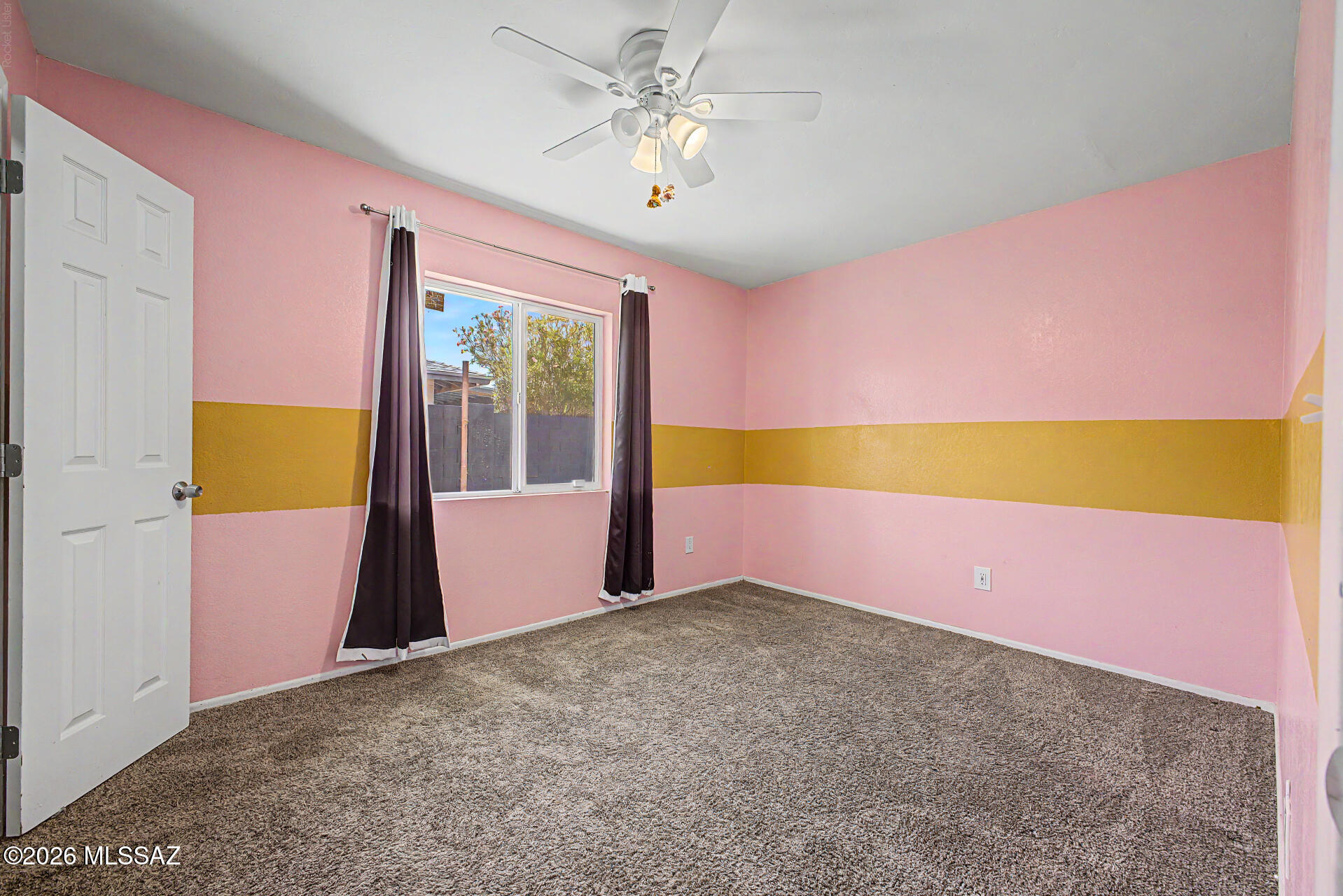 7550 East Rio Verde Drive Tucson, AZ 85715 - Photo 19 of 25 Natural light brightens this cheerful bedroom, creating a warm and welcoming atmosphere.