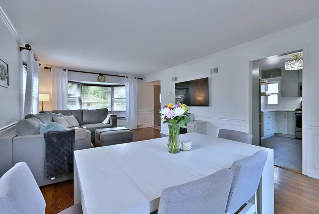 a view of a dining room with furniture and window