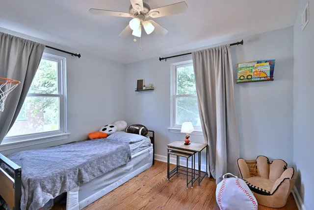 a bedroom with bed and a window