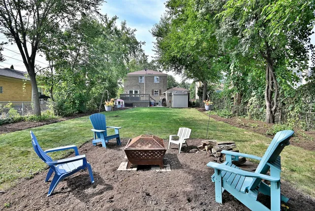 a view of a chairs and table in the yard