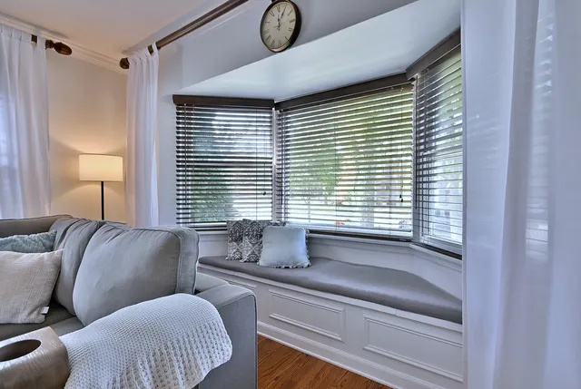 a bedroom with furniture and a window