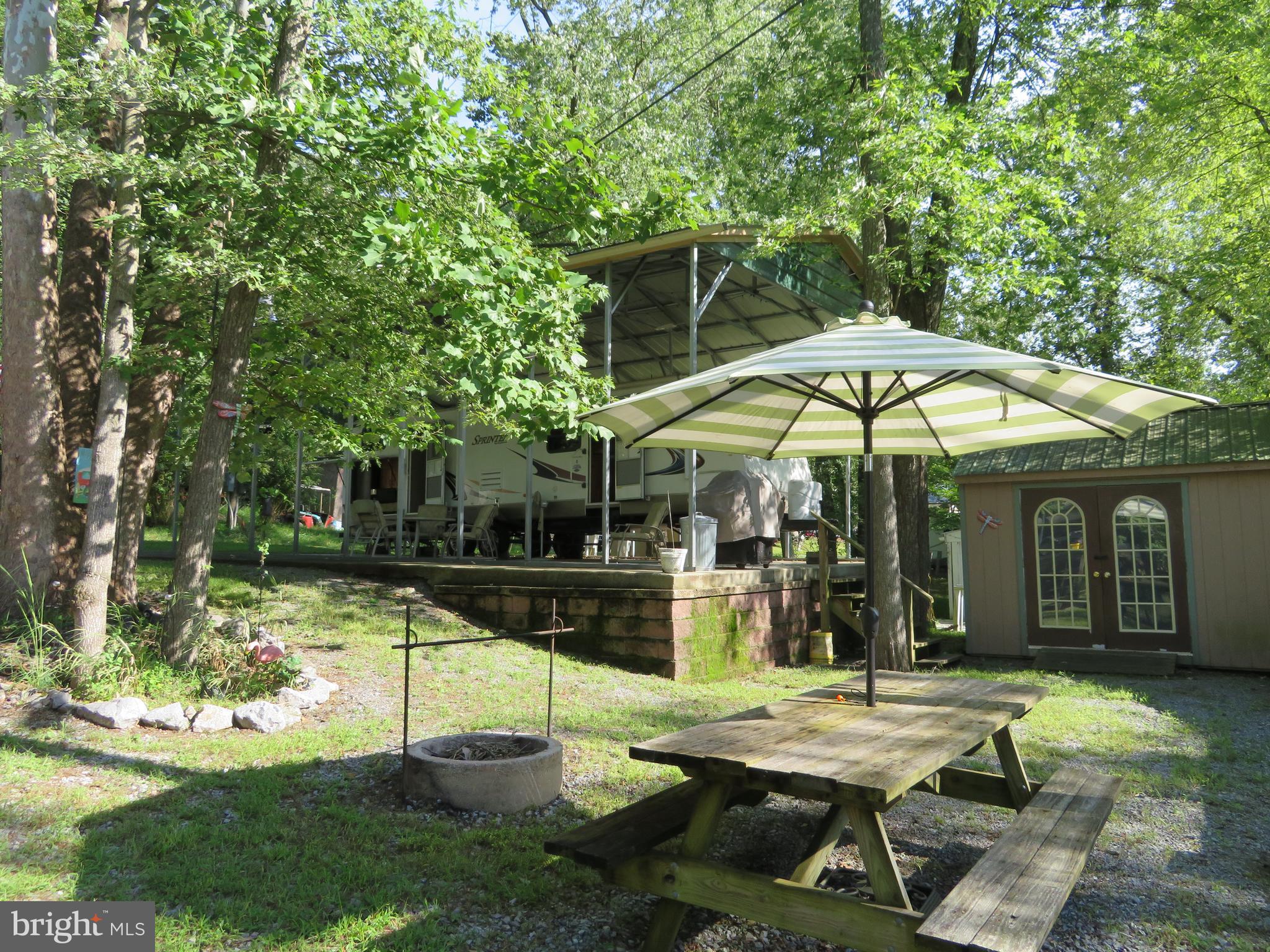 79-6 & 79-7 Detour Road Falling Waters, WV 25419 - Photo 3 of 29 Picnic & Fire Pit Area, Shed With Electric