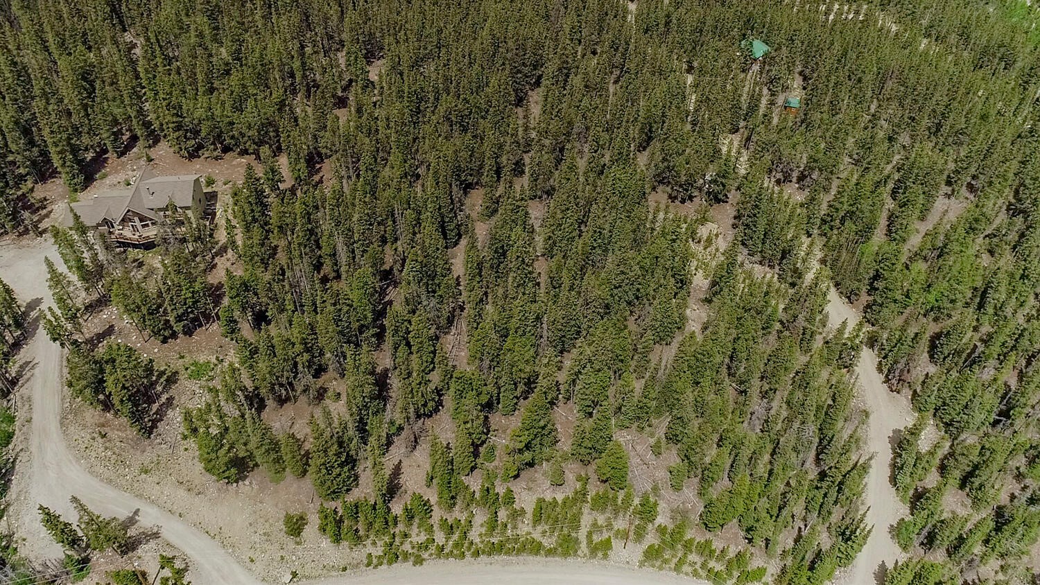 503 Golden Hills Road Fairplay, CO 80440 - Photo 23 of 36 Aerial view of property and surrounding area featuring a forest