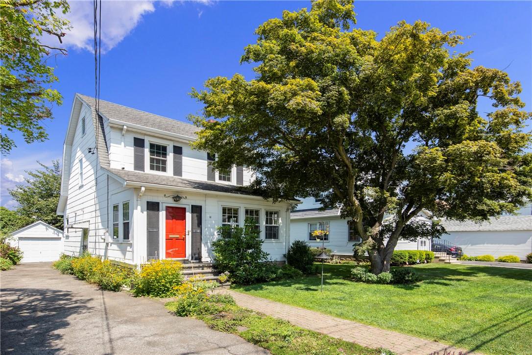 16 Henry Street Rye, NY 10580 - Photo 1 of 1 a front view of a house with a yard and potted plants