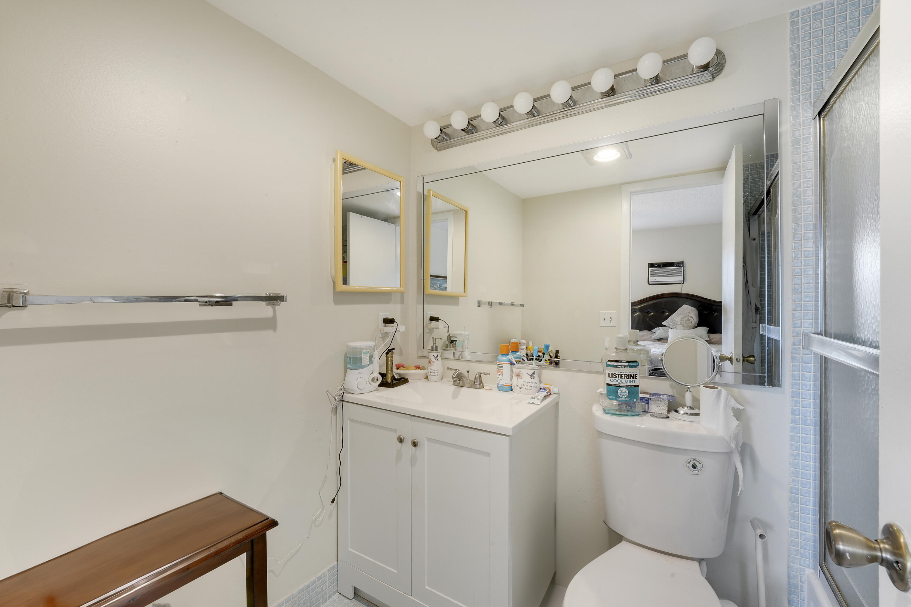 146 Mansfield D Boca Raton, FL 33434 - Photo 11 of 12 a bathroom with a sink vanity mirror and toilet