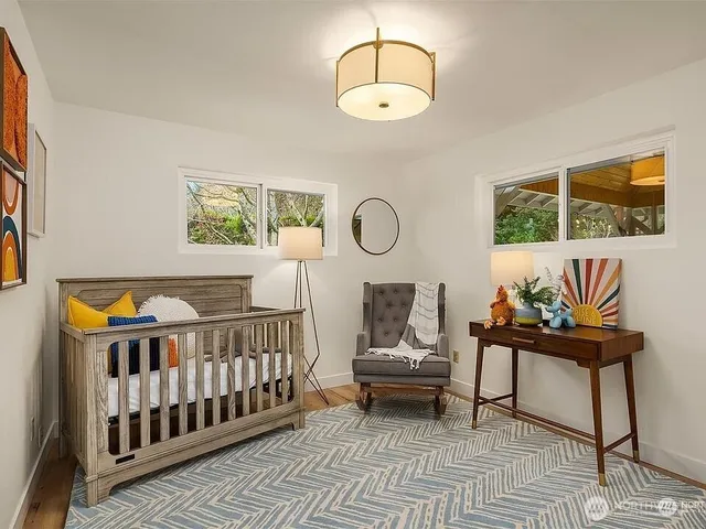 a bedroom with furniture and a window