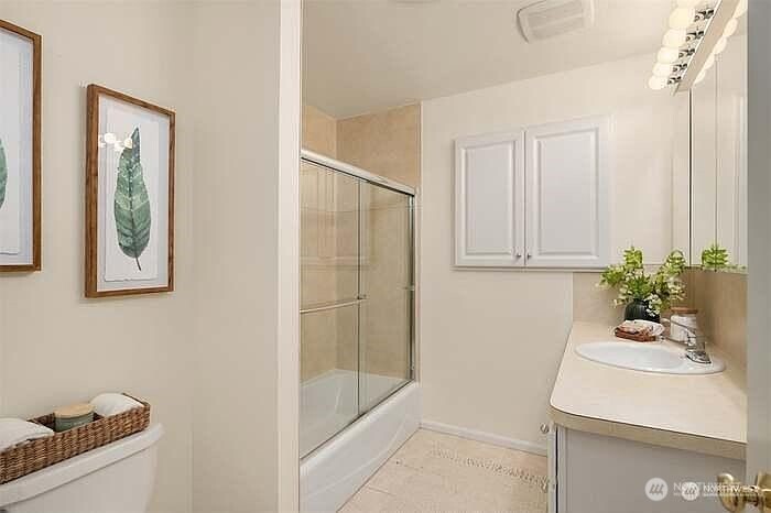 405 240th Street Southwest Bothell, WA 98021 - Photo 13 of 29 a bathroom with a sink and tub