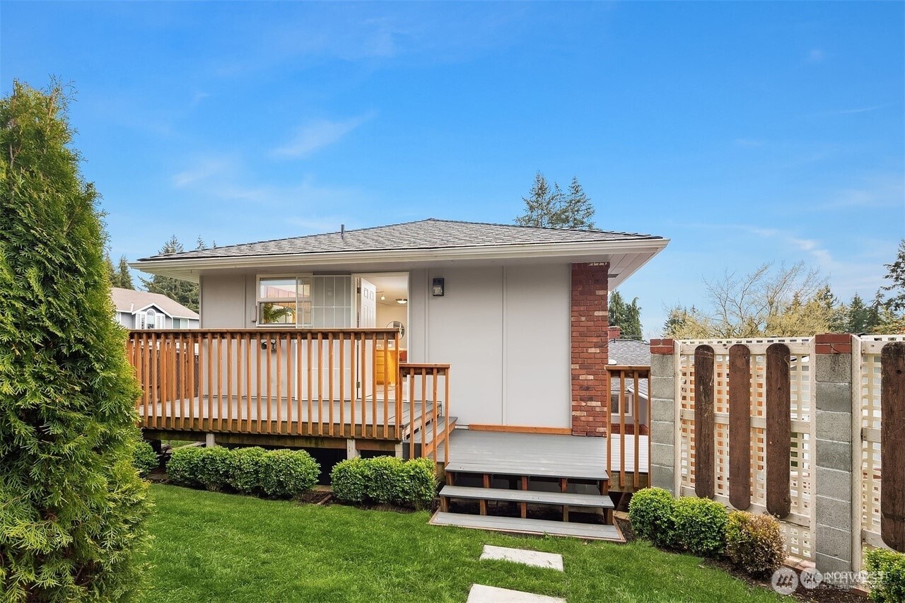 405 240th Street Southwest Bothell, WA 98021 - Photo 18 of 29 a view of a house with a yard and plants