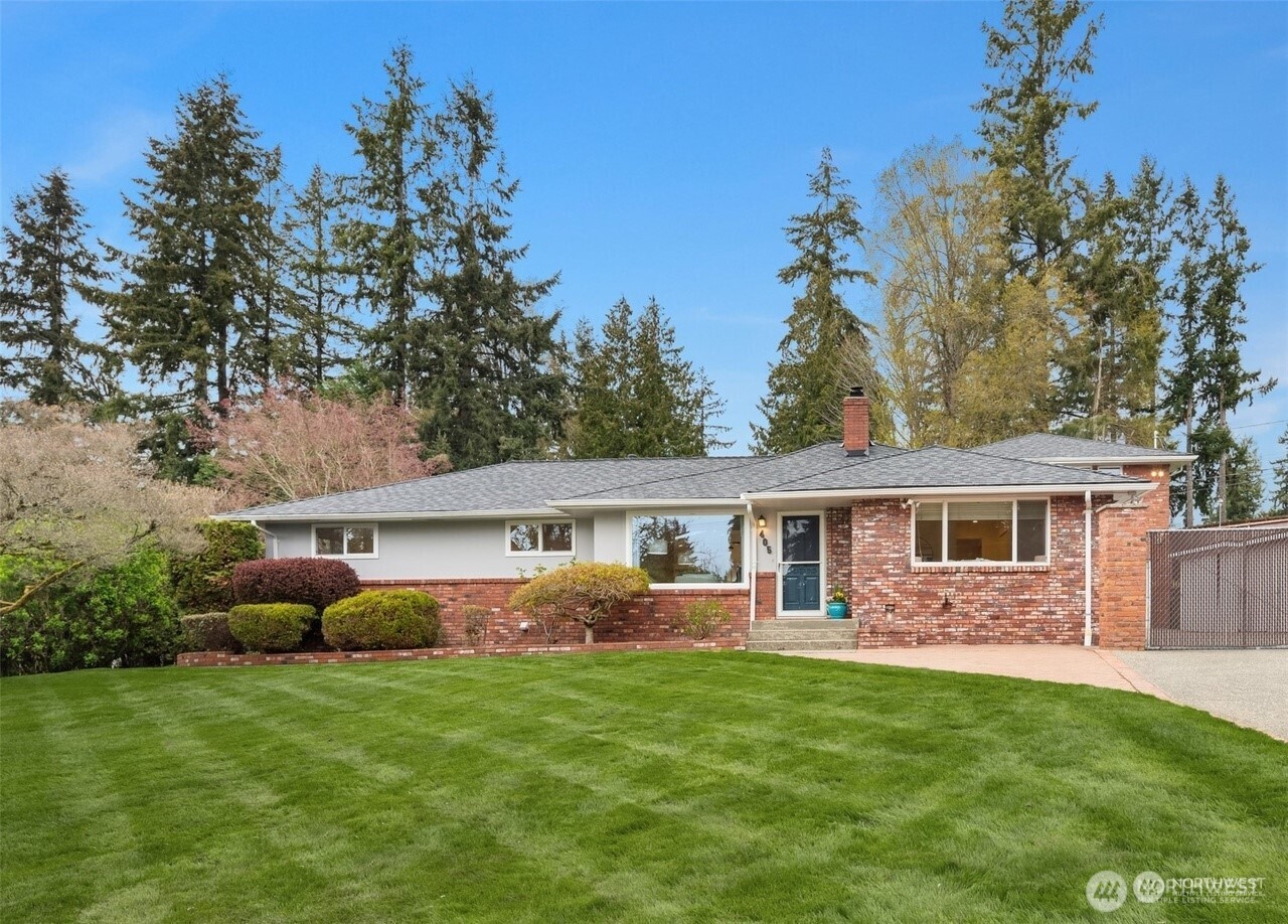 405 240th Street Southwest Bothell, WA 98021 - Photo 2 of 29 a front view of house with yard and green space