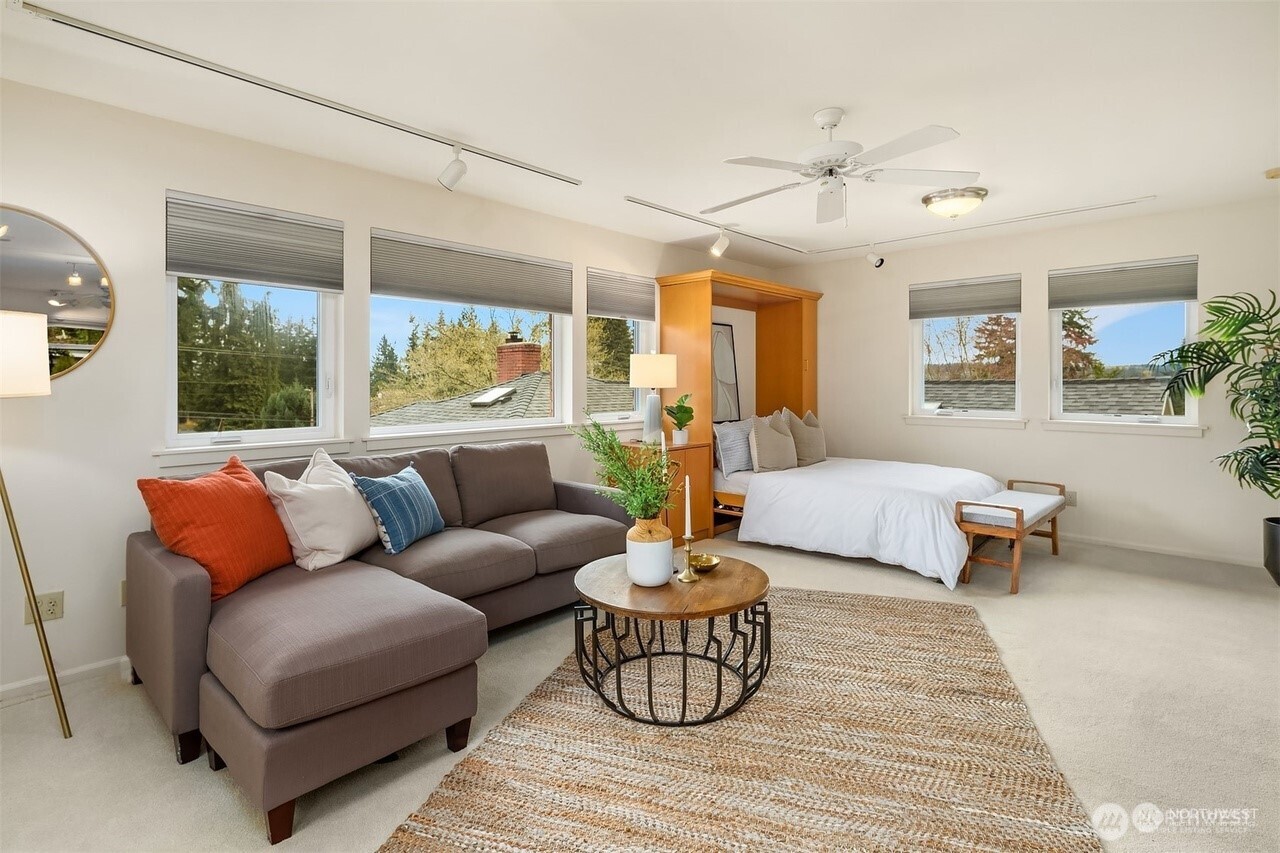 405 240th Street Southwest Bothell, WA 98021 - Photo 22 of 29 a living room with furniture and a large window