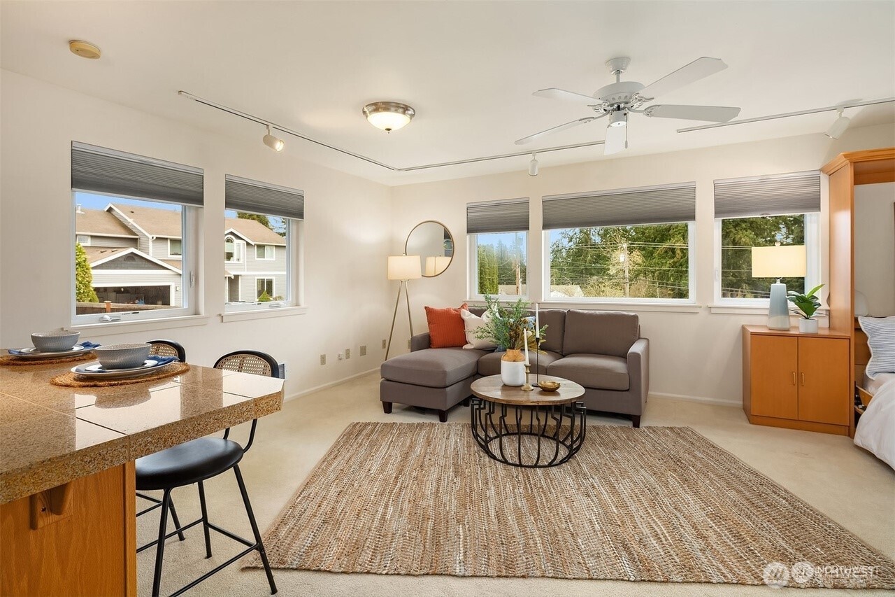 405 240th Street Southwest Bothell, WA 98021 - Photo 23 of 29 a living room with furniture and a large window