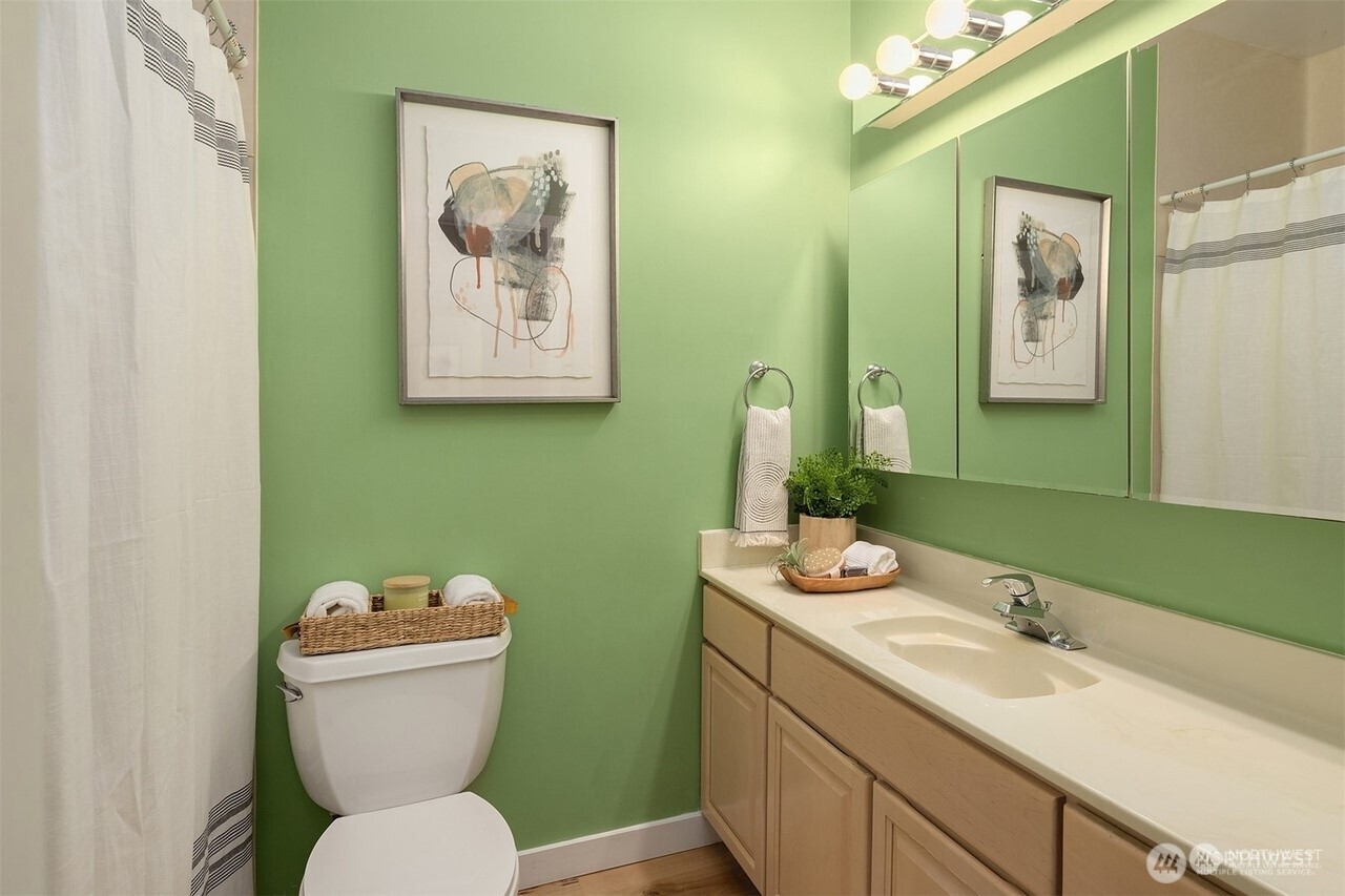 405 240th Street Southwest Bothell, WA 98021 - Photo 29 of 29 a bathroom with a toilet sink and mirror