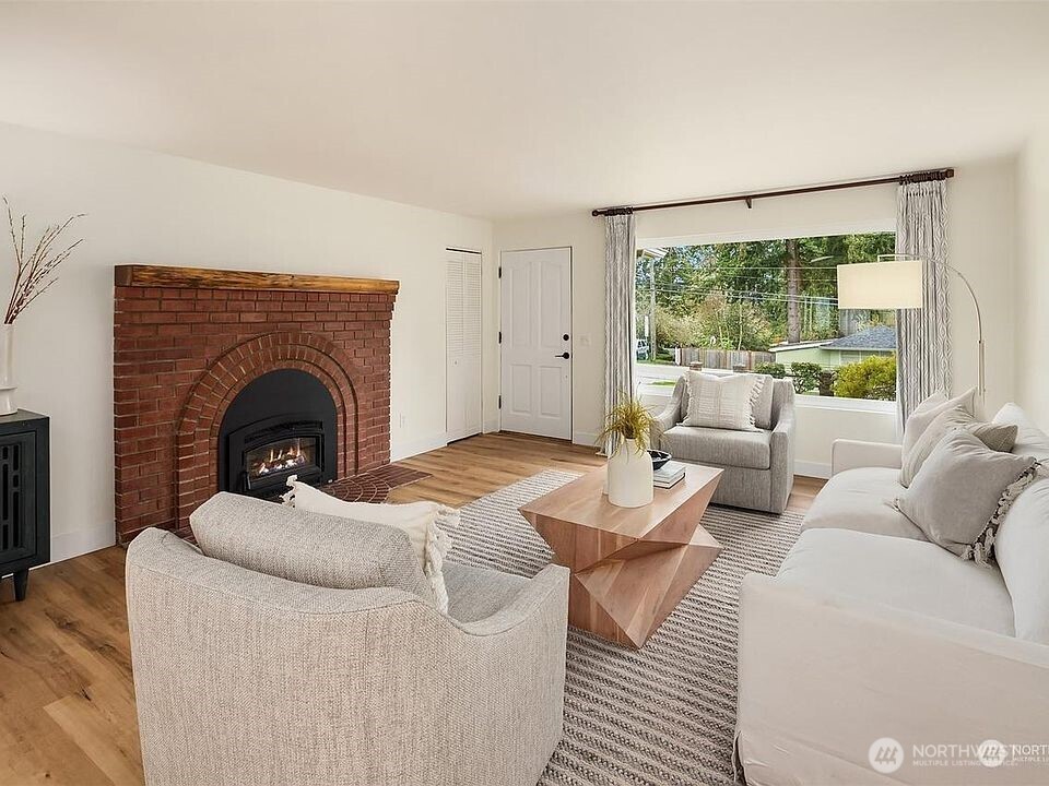 405 240th Street Southwest Bothell, WA 98021 - Photo 6 of 29 a living room with furniture and a fireplace
