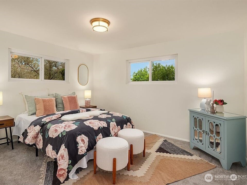 405 240th Street Southwest Bothell, WA 98021 - Photo 10 of 29 a bedroom with a bed and a window