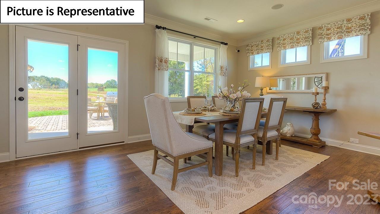 4249 Millstream Road Denver, NC 28037 - Photo 13 of 34 a view of a dining room with furniture window and outside view