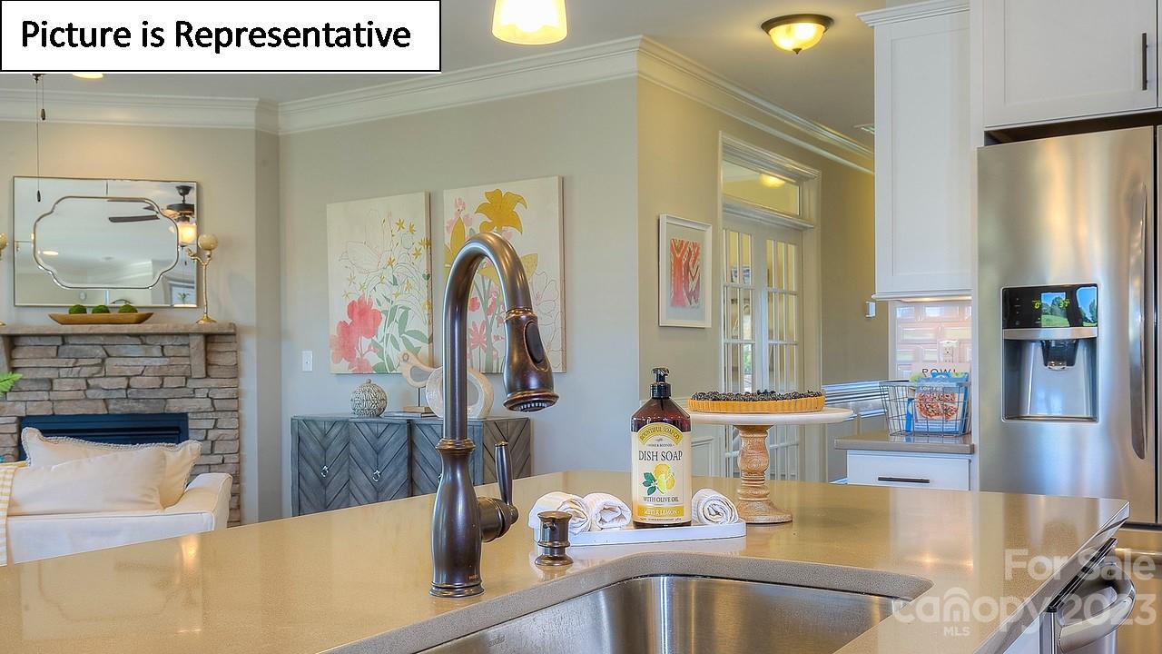 4249 Millstream Road Denver, NC 28037 - Photo 16 of 34 a kitchen with stainless steel appliances granite countertop a sink and a refrigerator