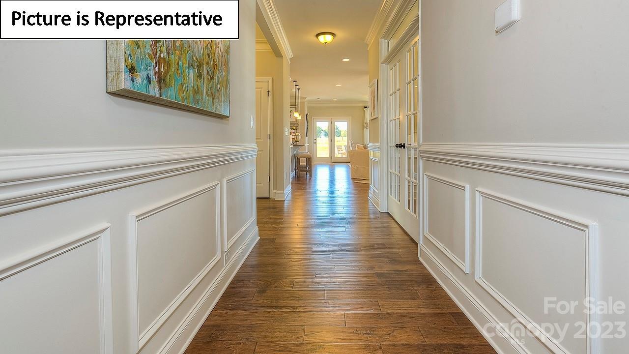 4249 Millstream Road Denver, NC 28037 - Photo 2 of 34 a hallway with wooden floor