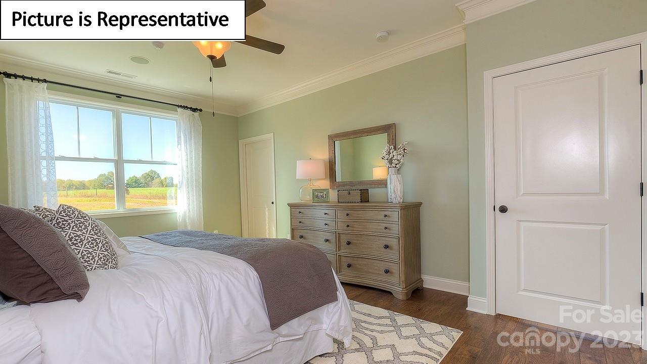 4249 Millstream Road Denver, NC 28037 - Photo 30 of 34 a bedroom with a bed and a dresser