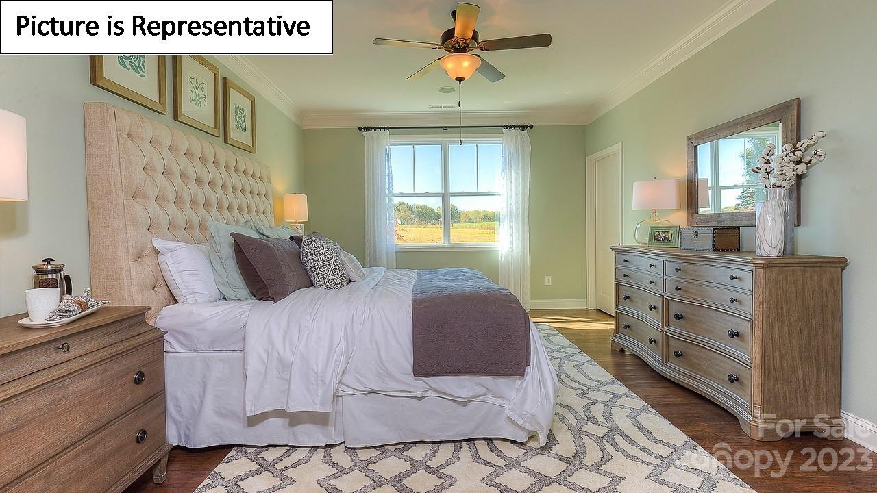 4249 Millstream Road Denver, NC 28037 - Photo 31 of 34 a bedroom with a bed and a dresser