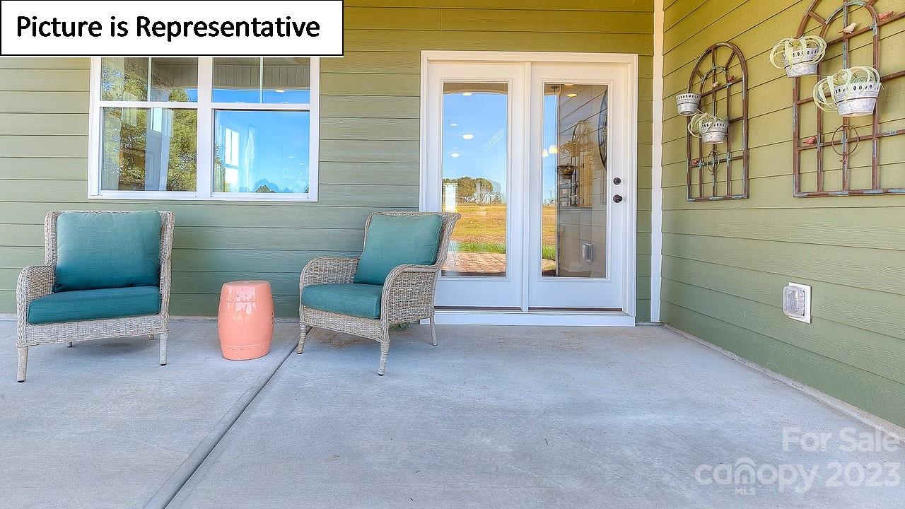 4249 Millstream Road Denver, NC 28037 - Photo 33 of 34 a view of an house with entryway and outdoor seating