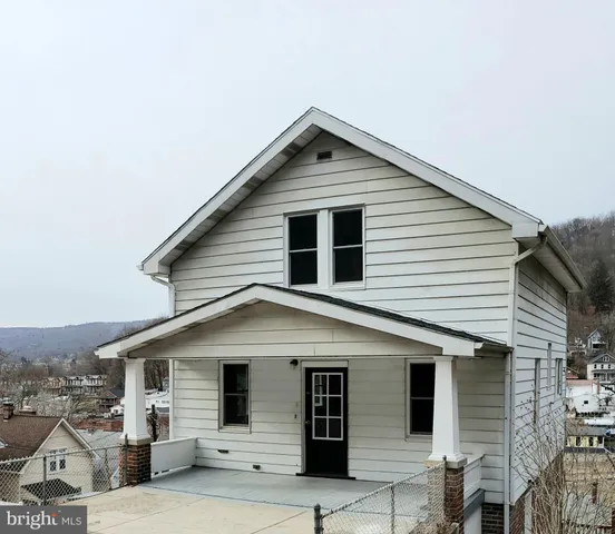 a front view of a house with garage