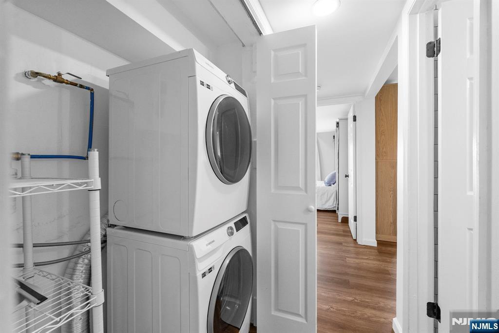 101 Highway 5, Unit 206 Edgewater, NJ 07020 - Photo 17 of 48 a view of a storage and utility room with washer and dryer
