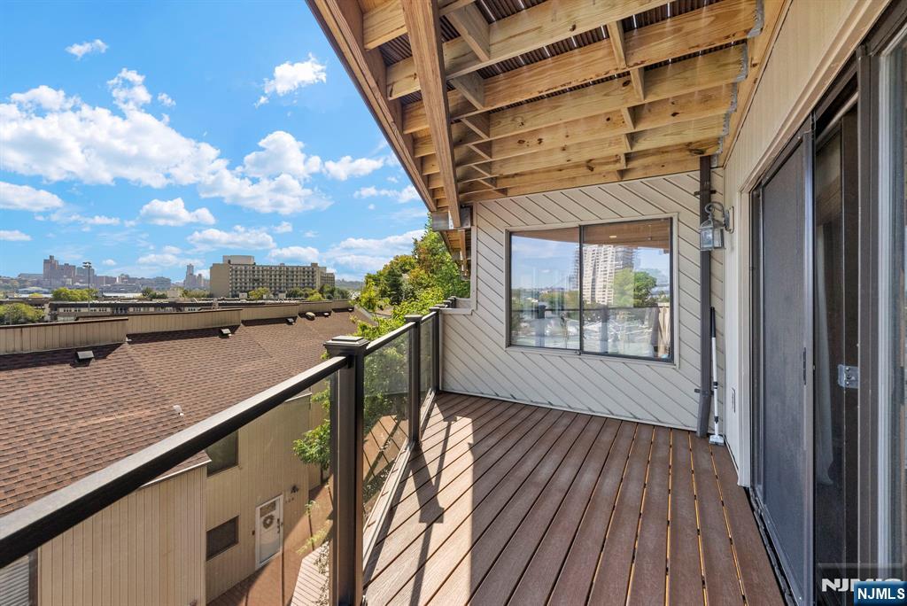 101 Highway 5, Unit 206 Edgewater, NJ 07020 - Photo 26 of 48 a view of balcony with wooden floor