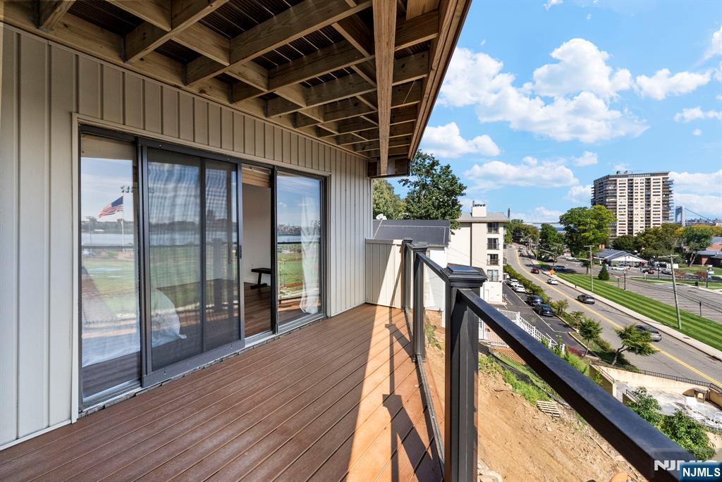 101 Highway 5, Unit 206 Edgewater, NJ 07020 - Photo 27 of 48 a view of a balcony with wooden floor