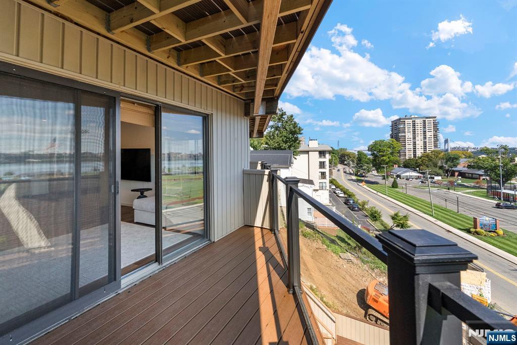 101 Highway 5, Unit 206 Edgewater, NJ 07020 - Photo 32 of 48 a view of balcony with wooden floor
