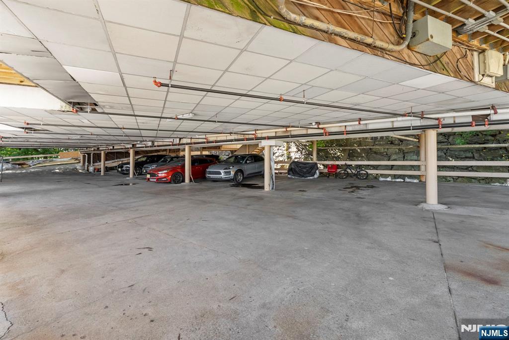 101 Highway 5, Unit 206 Edgewater, NJ 07020 - Photo 37 of 48 a view of a garage with cars