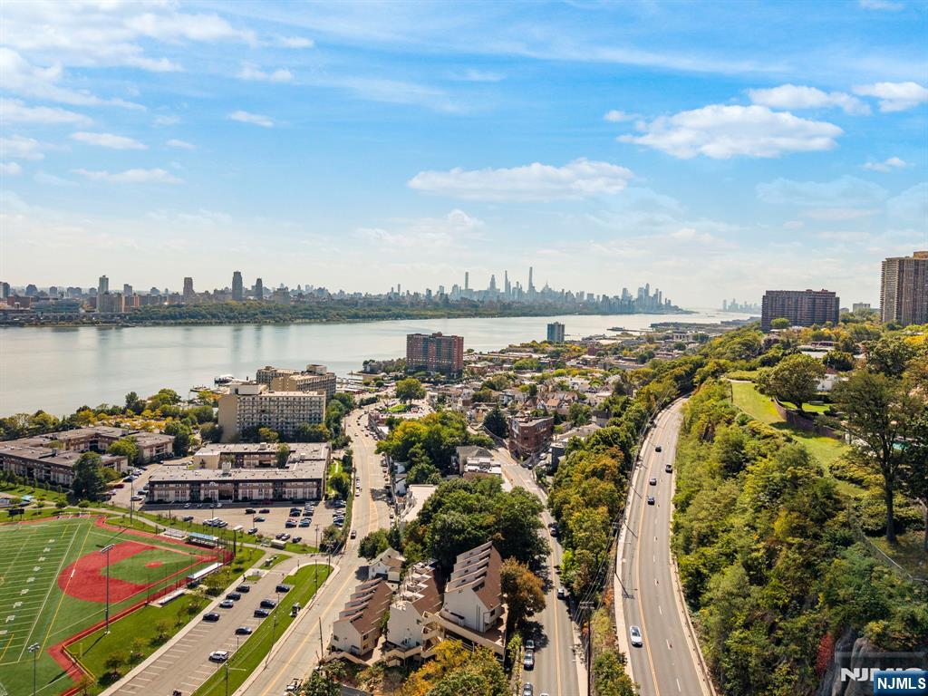 101 Highway 5, Unit 206 Edgewater, NJ 07020 - Photo 47 of 48 a view of a lake with houses in back