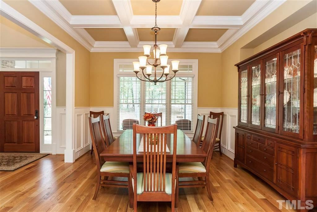 5515 Strathmore Drive Raleigh, NC 27613 - Photo 4 of 25 Dining Room with coffered ceiling, wainscot and hardwood floors. Dining Room