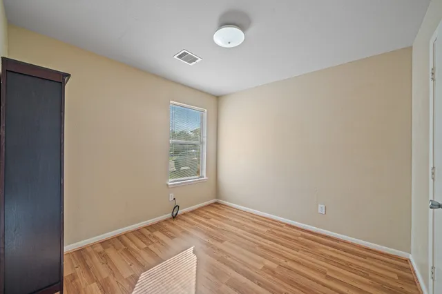 a view of room with window and ceiling fan
