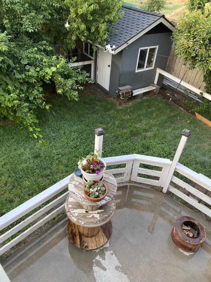 601 Fall River Drive Modesto, CA 95351 - Photo 8 of 8 a view of a patio with table and chairs and potted plants