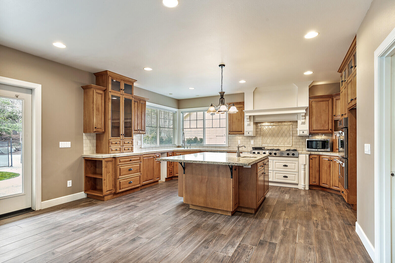 2225 Old Stage Road Central Point, OR 97502 - Photo 6 of 37 a large kitchen with stainless steel appliances lots of counter space and a sink