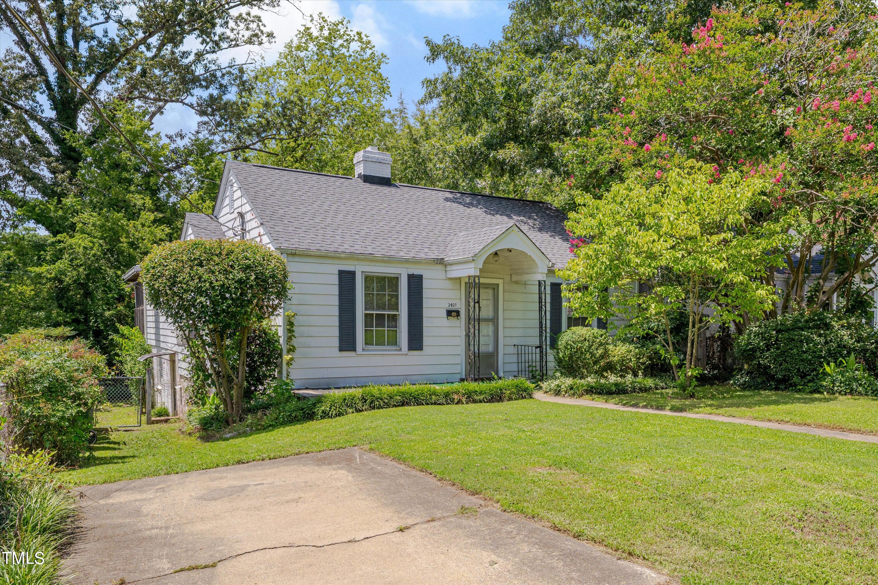 2421 Farthing Street Durham, NC 27704 - Photo 1 of 31 a front view of house with yard and green space