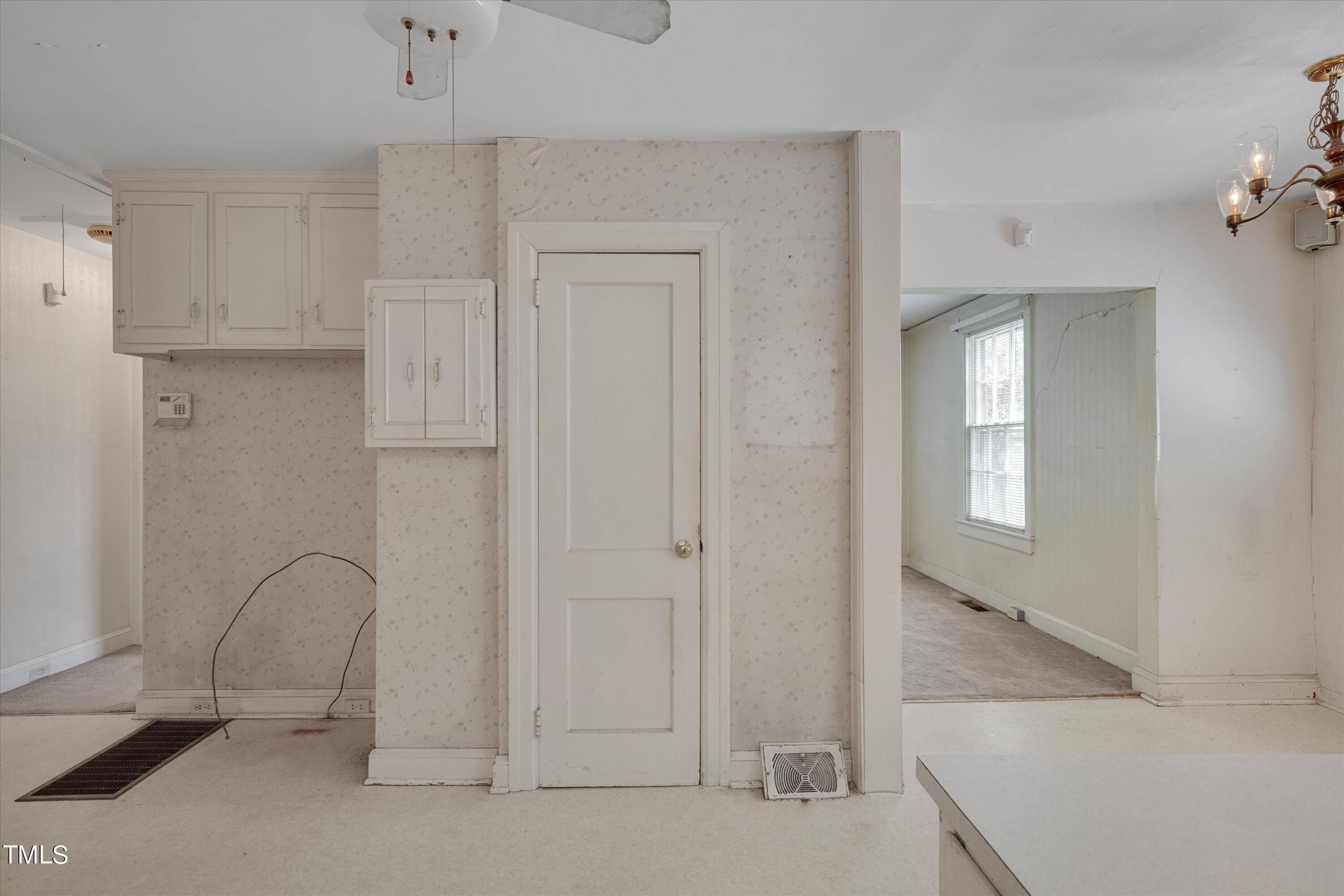 2421 Farthing Street Durham, NC 27704 - Photo 11 of 31 a view of an empty room with window and cabinet