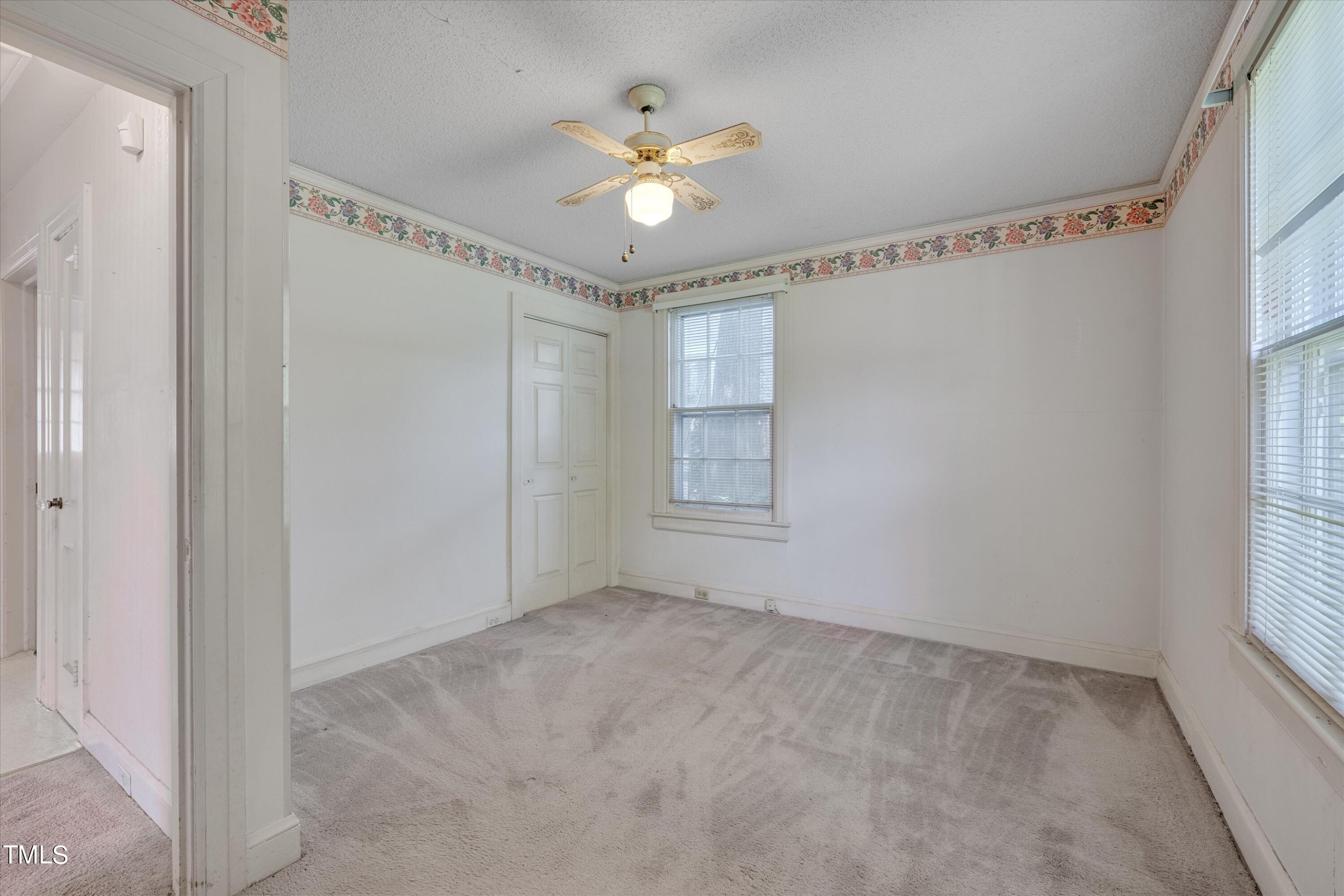 2421 Farthing Street Durham, NC 27704 - Photo 12 of 31 a view of an empty room with a window