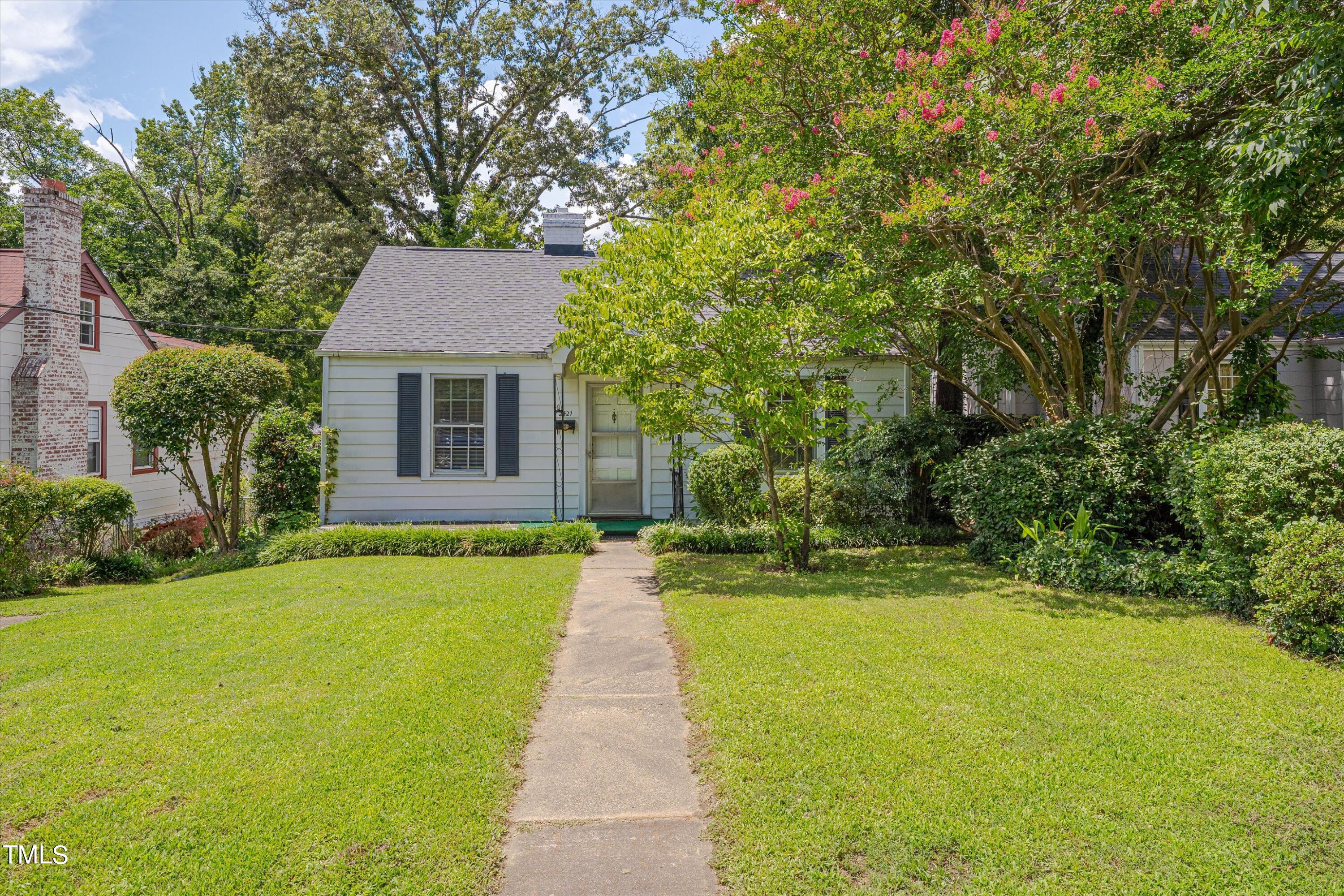 2421 Farthing Street Durham, NC 27704 - Photo 2 of 31 a front view of a house with a yard and trees