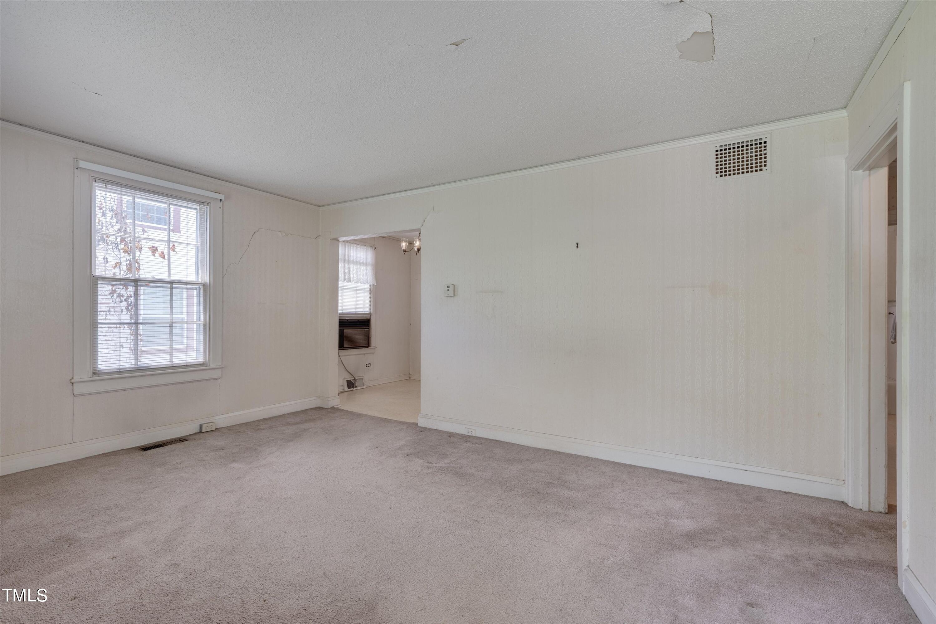 2421 Farthing Street Durham, NC 27704 - Photo 4 of 31 an empty room with windows